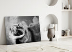 Smoke Dancer glass wall art styled above a coffee table in a master bedroom