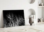 Night Trees glass wall art styled above a credenza in a master bedroom