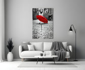 Red Umbrella glass wall art styled above a console in a hallway