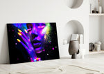 UV Glow glass wall art styled above a sofa in a bar