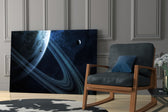 Ringed Saturn artwork anchoring a wall with cosmic mystical palette