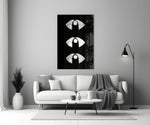 Silver Lip Stack glass wall art styled above a bed in a master bedroom
