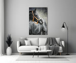 Black Stallion glass wall art styled above a console in a hallway