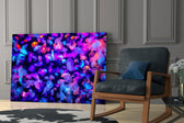 Neon Jellies artwork anchoring a wall with cool marine palette