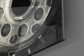 Vintage Engine panel catching brass-light to reveal its tactile rivet