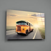 Caravan Sunset close-up showing orange-cream bus on golden country road