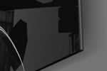 Hourglass Time panel catching window light to reveal its tactile flow