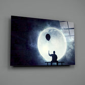 Moon Dreamer close-up showing silhouetted figure holding balloon under moon