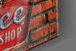 Diner Sign panel catching window light to reveal its tactile patina
