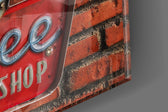 Diner Sign panel catching window light to reveal its tactile patina