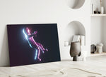 Astronaut glass wall art styled above a console in a gaming room