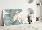 Leaves glass wall art styled above a credenza in a living room