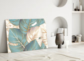 Leaves glass wall art styled above a credenza in a living room