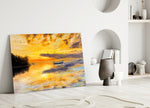 Landscape glass wall art styled above a console in a living room