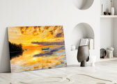 Landscape glass wall art styled above a console in a living room