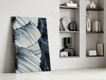 Abstract artwork anchoring a wall with moody minimal palette