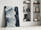 Abstract artwork anchoring a wall with moody minimal palette
