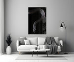 Snake glass wall art styled above a credenza in a gaming room
