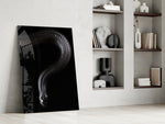 Snake artwork anchoring a wall with bold mysterious palette