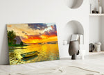 Sunset Fishing glass wall art styled above a console in a living room
