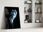 Hand artwork anchoring a wall with bold modern palette
