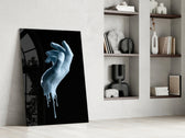 Hand artwork anchoring a wall with bold modern palette