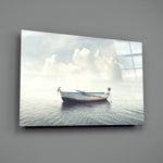 Marine close-up showing rowboat with figure reaching over to still water