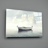 Marine close-up showing rowboat with figure reaching over to still water