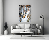 Abstract glass wall art styled above a credenza in a living room