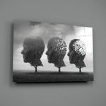 Autumn of Thoughts close-up showing three head-shaped trees with leaves blowing