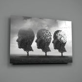 Autumn of Thoughts close-up showing three head-shaped trees with leaves blowing