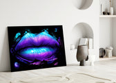 Lip glass wall art styled above a sofa in a bedroom