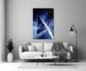Abstract glass wall art styled above a credenza in a living room