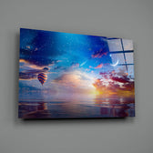 Landscape close-up showing crescent moon and balloon over coral sunset sea
