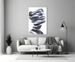 Man glass wall art styled above a credenza in a living room