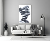 Man glass wall art styled above a credenza in a living room