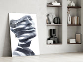 Man artwork anchoring a wall with contemplative monochrome palette