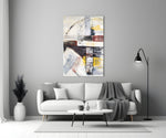 Abstract glass wall art styled above a sofa in a living room