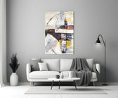 Abstract glass wall art styled above a sofa in a living room