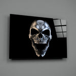 Skull close-up showing chrome-polished bone and cast shadow