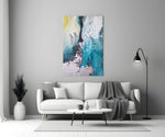 Colors of Abstraction glass wall art styled above a sofa in a living room