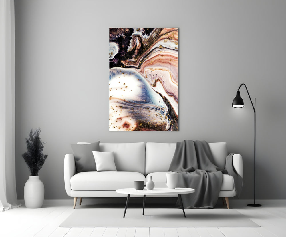 Abstract glass wall art styled above a console in a living room