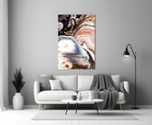 Abstract glass wall art styled above a console in a living room