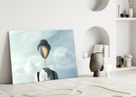 Balloon Heads glass wall art styled above a desk in a study