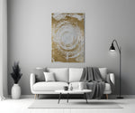 Abstract Loop glass wall art styled above a credenza in a living room
