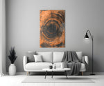 Abstract Loop glass wall art styled above a sofa in a living room