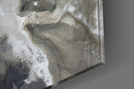 Marble panel catching window light to reveal its tonal calm