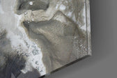 Marble panel catching window light to reveal its tonal calm