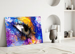 Pupil glass wall art styled above a sofa in a bedroom