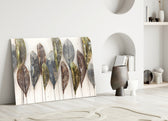 Feathers glass wall art styled above a credenza in a living room